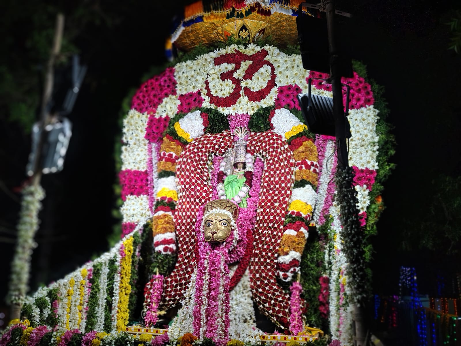 Flower-decorated procession at night